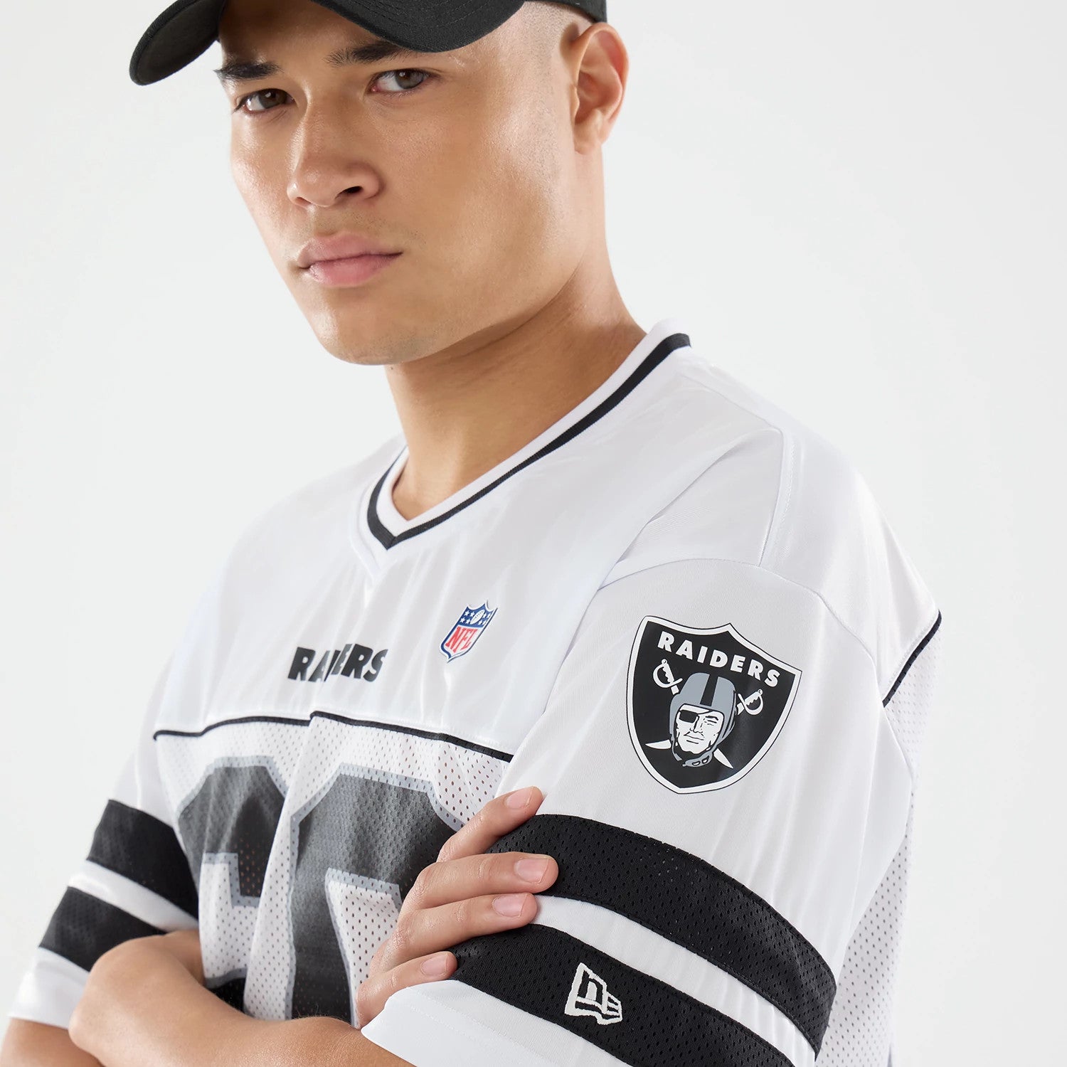 The model is wearing this NFL Las Vegas Raiders Mesh Jersey in white. 3