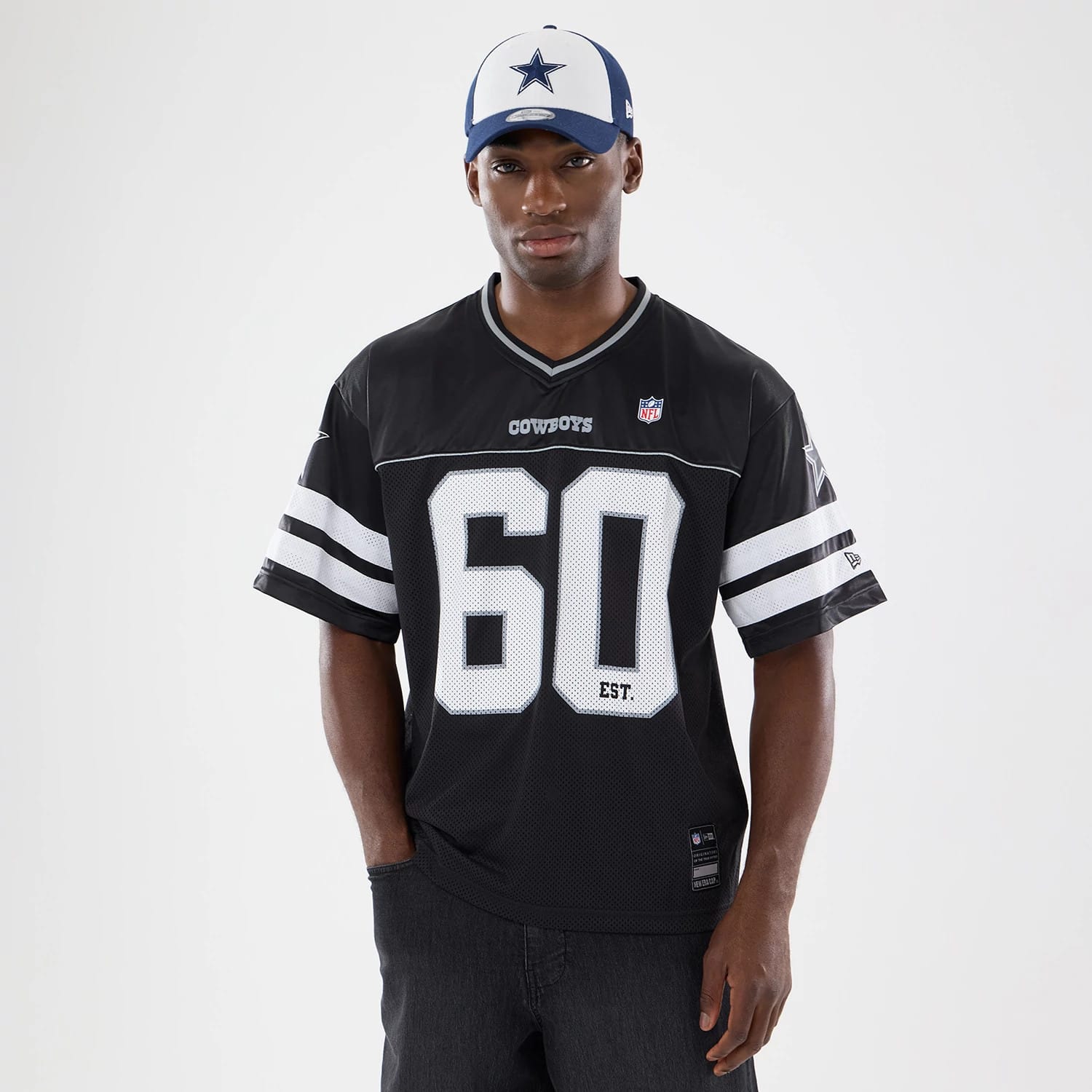 The model is wearing this NFL Dallas Cowboys Mesh Jersey in black. 1