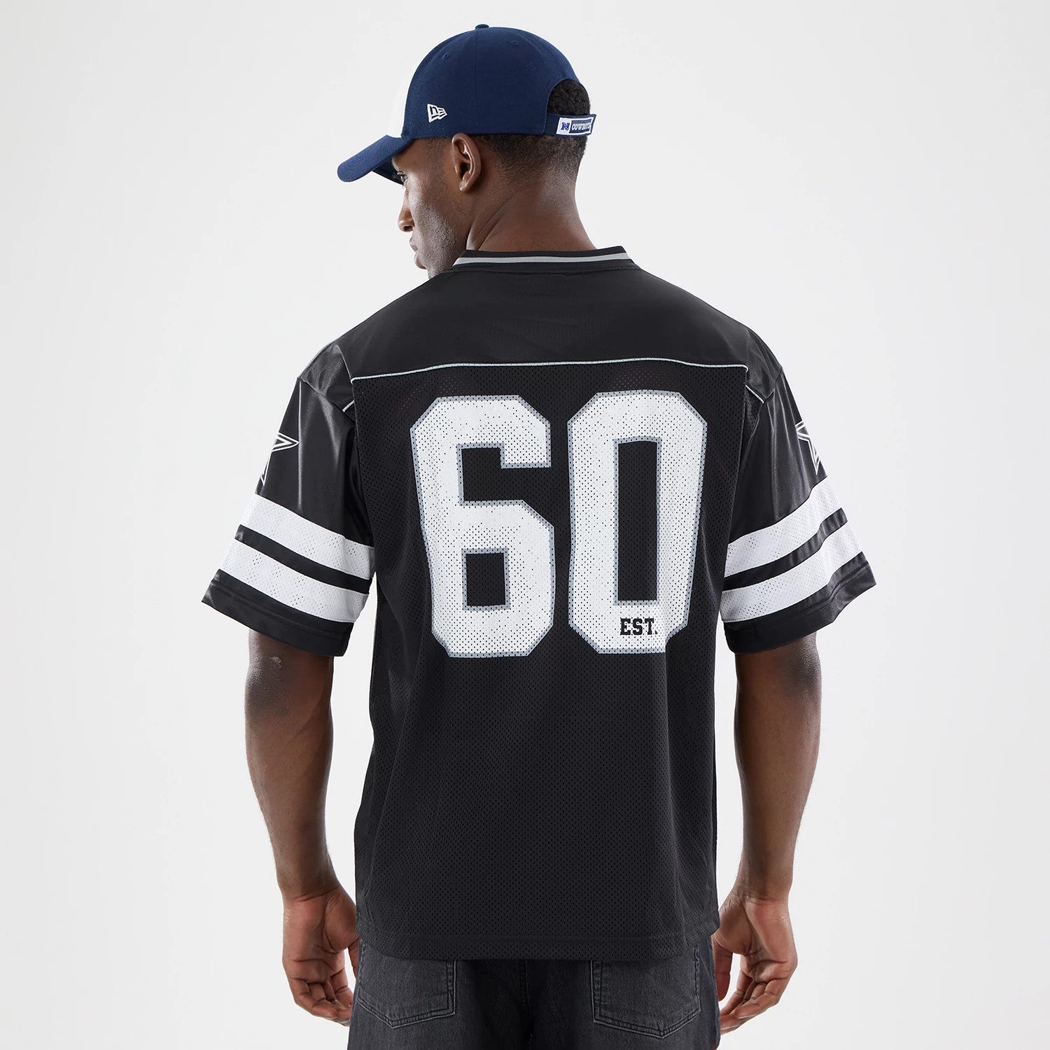 The model is wearing this NFL Dallas Cowboys Mesh Jersey in black. 2