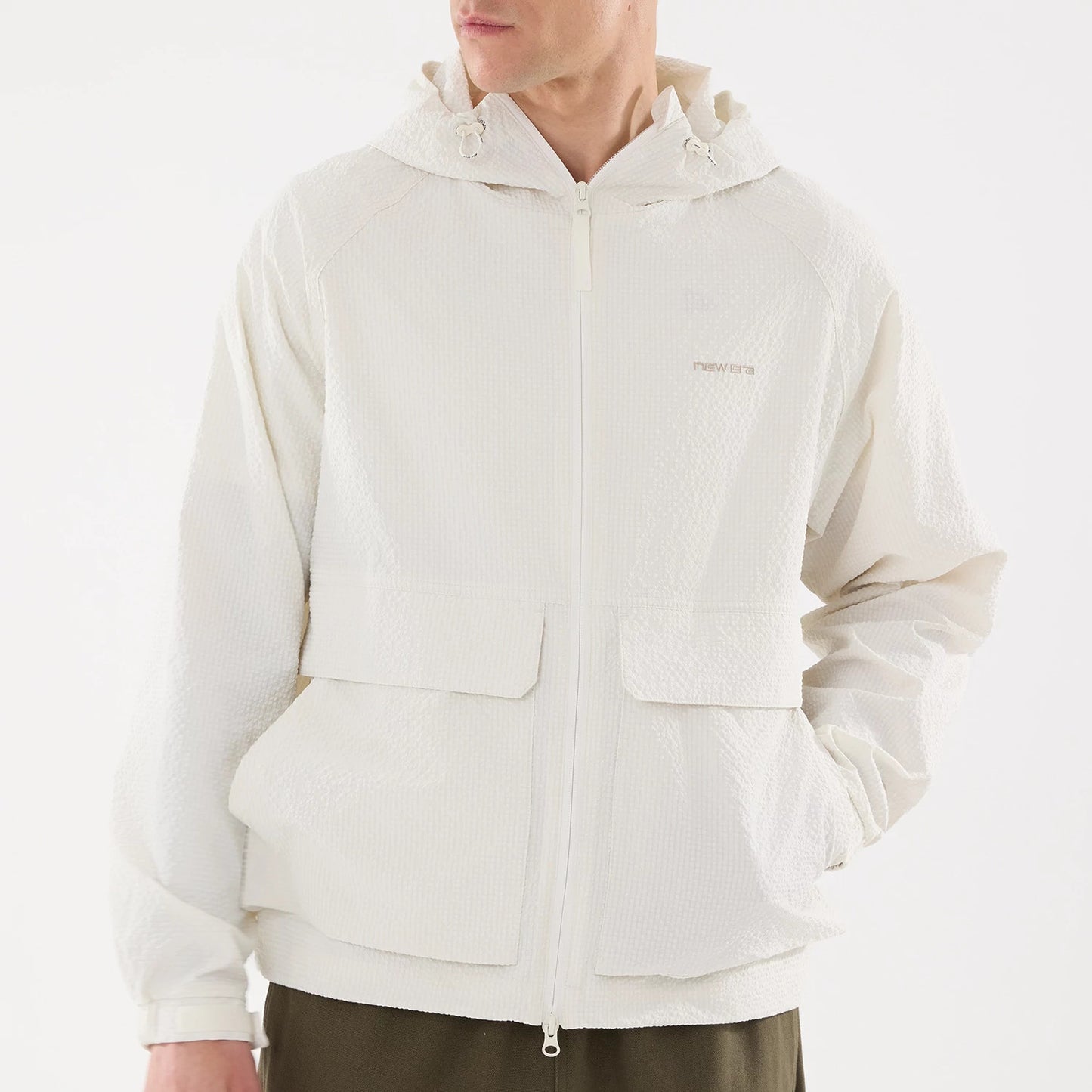 The model is wearing this New Era Black Label Jacket in open white. 3
