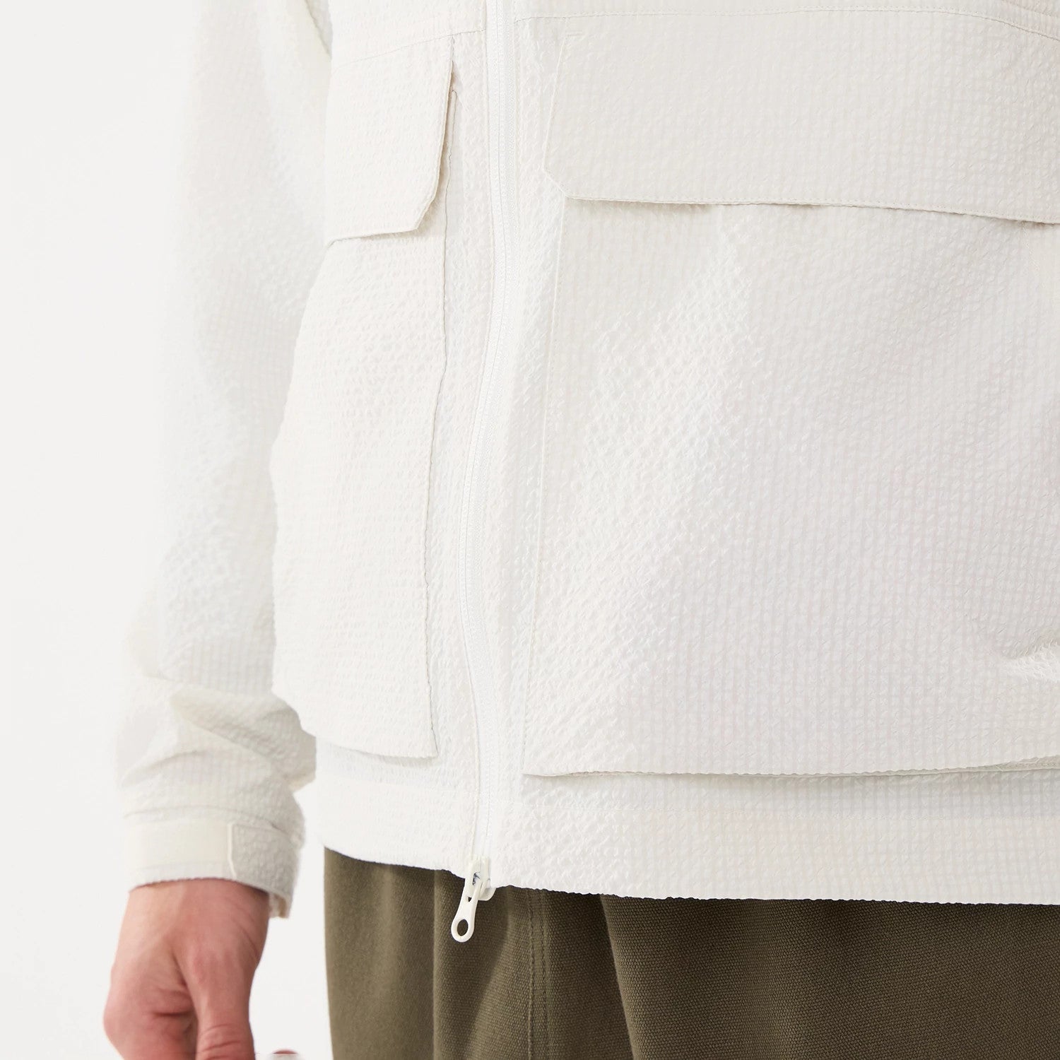 The model is wearing this New Era Black Label Jacket in open white. 6