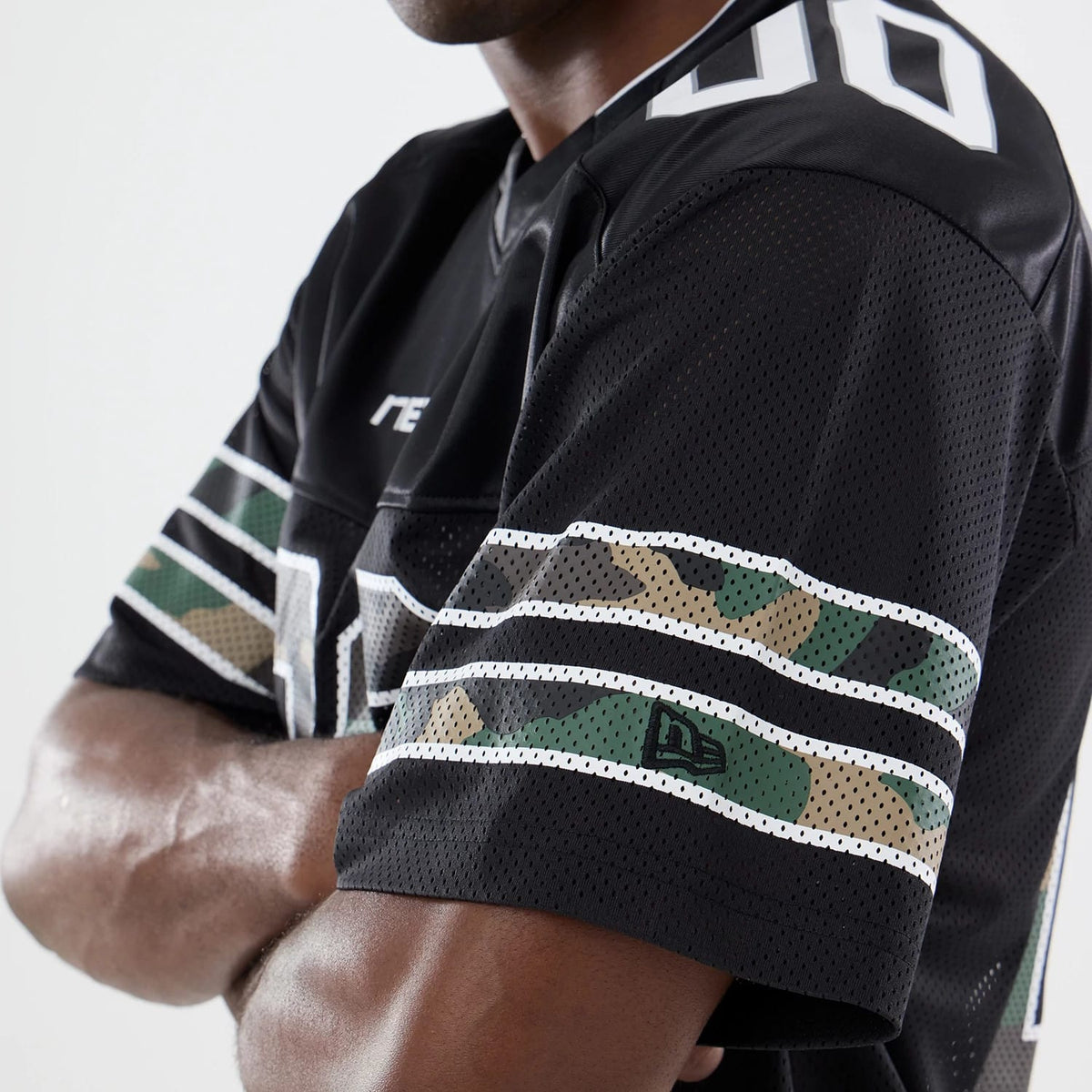 The model is wearing this New Era 1920 Mesh Jersey in black. 3