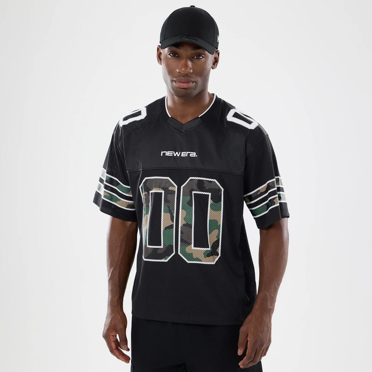 The model is wearing this New Era 1920 Mesh Jersey in black. 1
