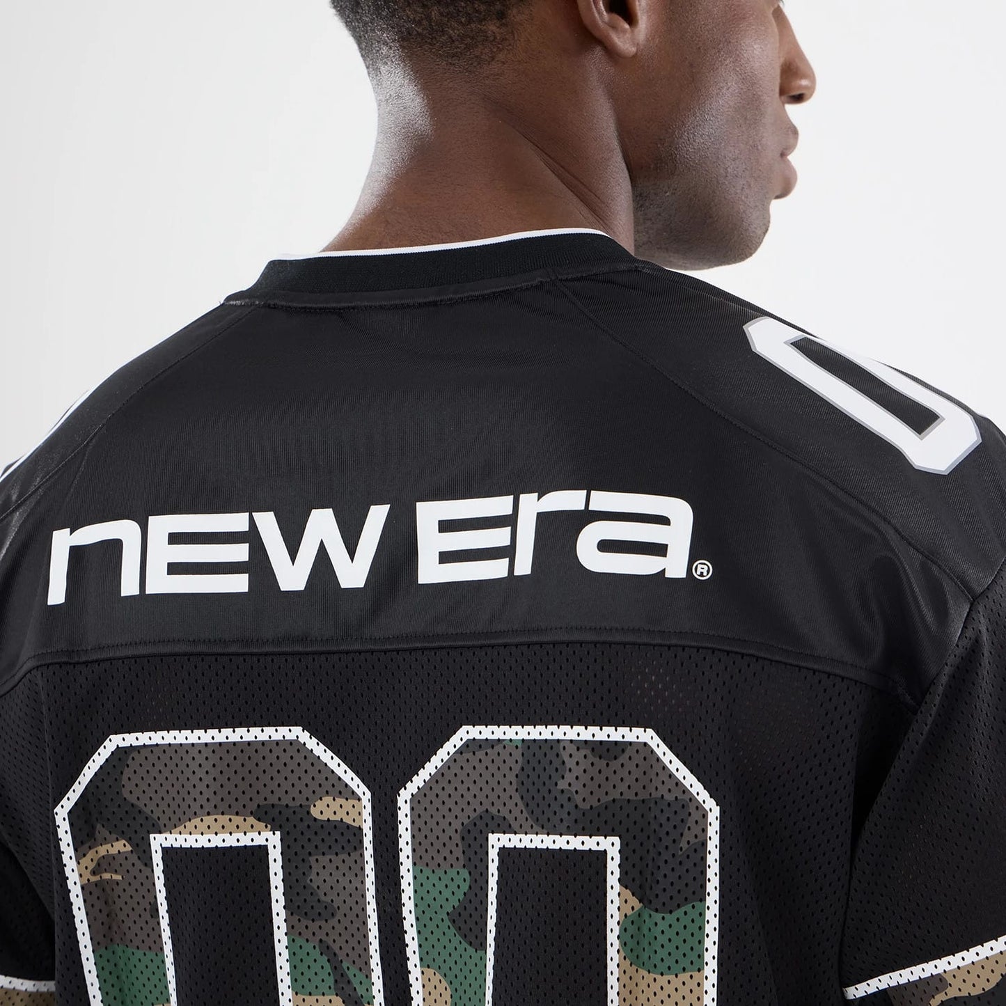 The model is wearing this New Era 1920 Mesh Jersey in black. 5