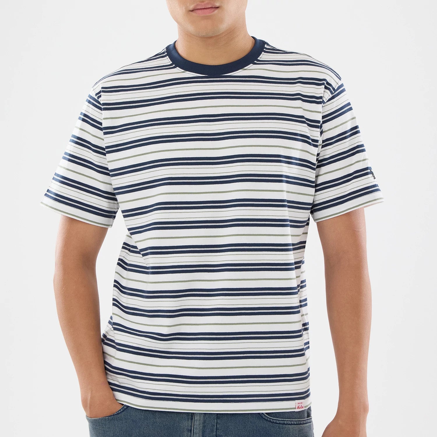 The model is wearing this New Era Boarder Stripe T-Shirt in white. 4