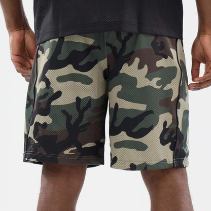 The model is wearing this New Era Bermuda Oversized Shorts in 6 Day Camo. 5