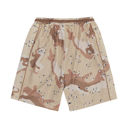 The model is wearing this New Era Bermuda Oversized Shorts in Woodland Camo. 6