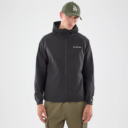 The model is wearing this New Era Windbreaker Jacket in black. 1