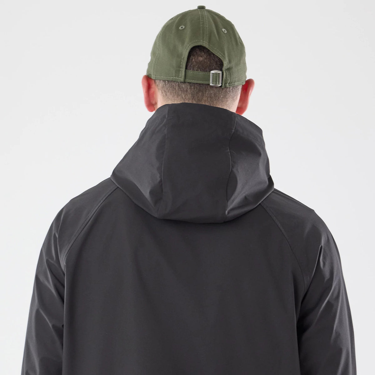 The model is wearing this New Era Windbreaker Jacket in black. 6