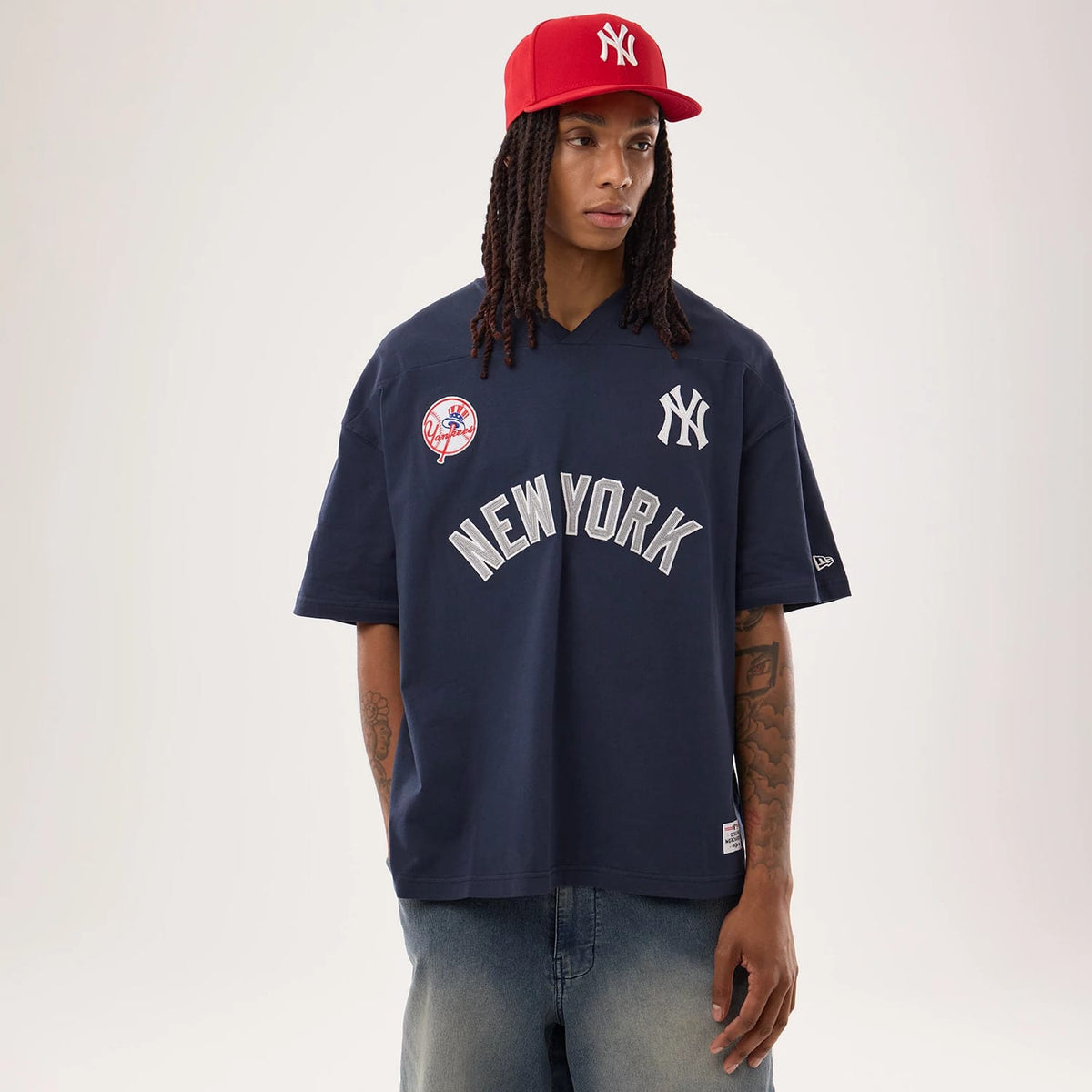 The model is wearing this MLB Fan Family New York Yankees Jersey in navy. 1
