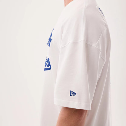Los Angeles Dodgers MLB Fan Family White Jersey, side view on a model featuring blue Dodgers lettering across the chest, with a New Era flag logo embroidered on the left sleeve above the hem.