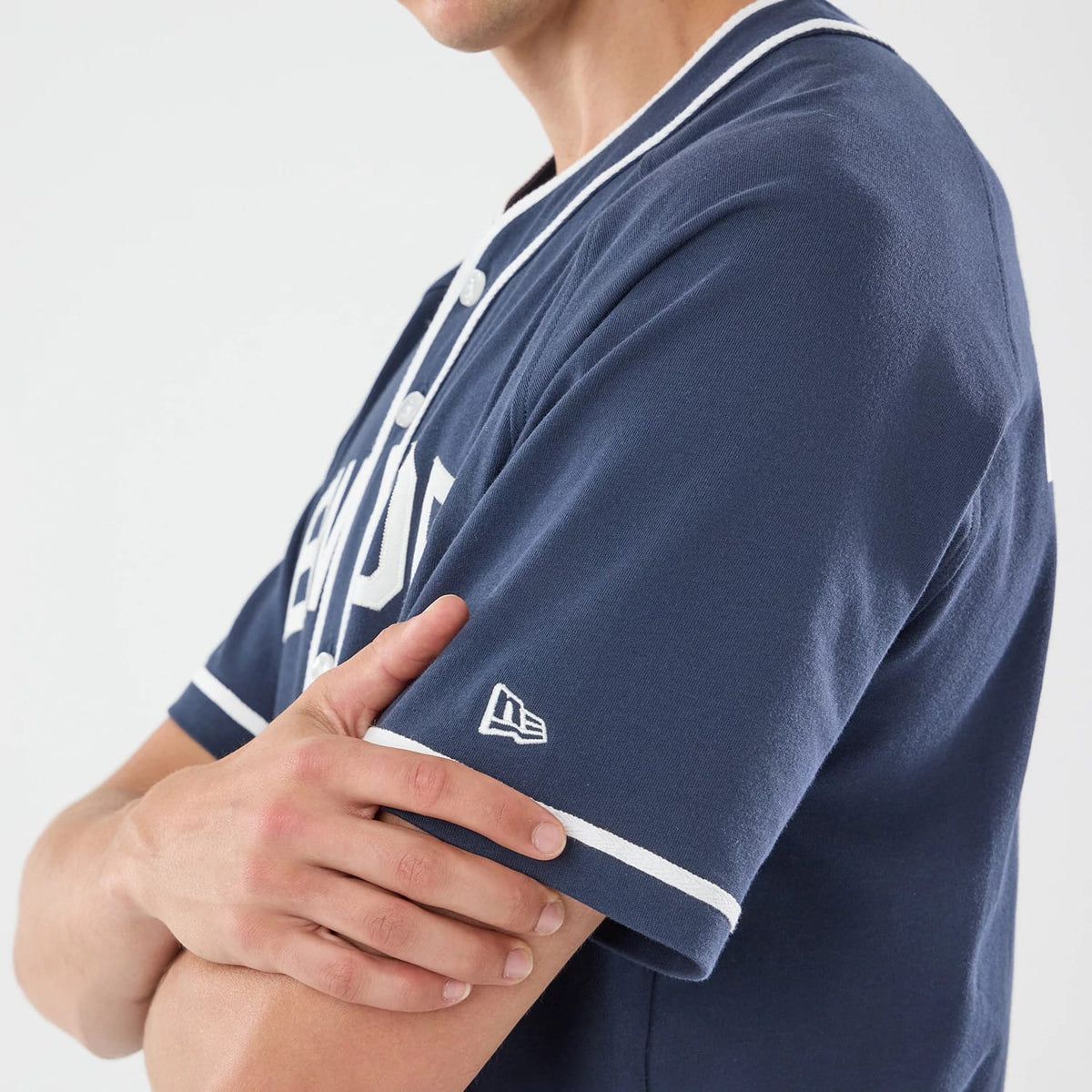 The model is wearing this New Era New York Jersey in navy. 6