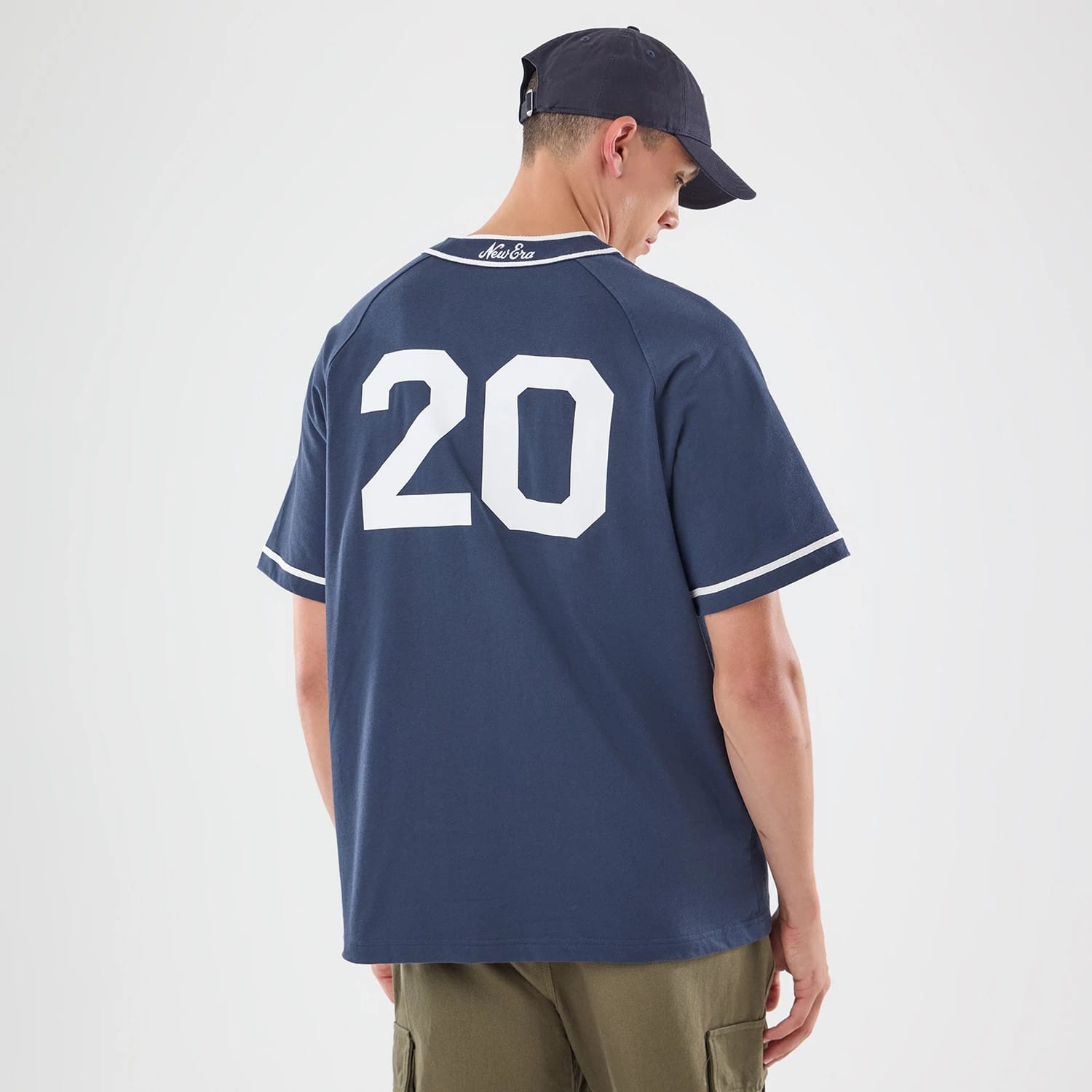 The model is wearing this New Era New York Jersey in navy. 2
