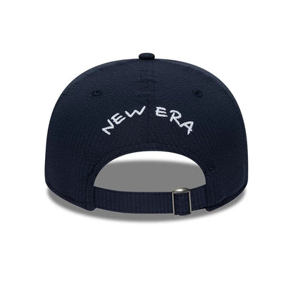 Pictured is this New Era Seersucker Retro Crown 9FIFTY cap in navy. 4