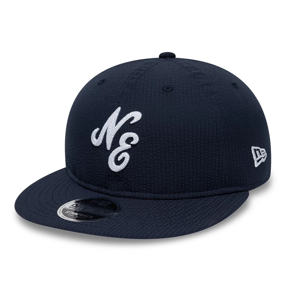Pictured is this New Era Seersucker Retro Crown 9FIFTY cap in navy. 1