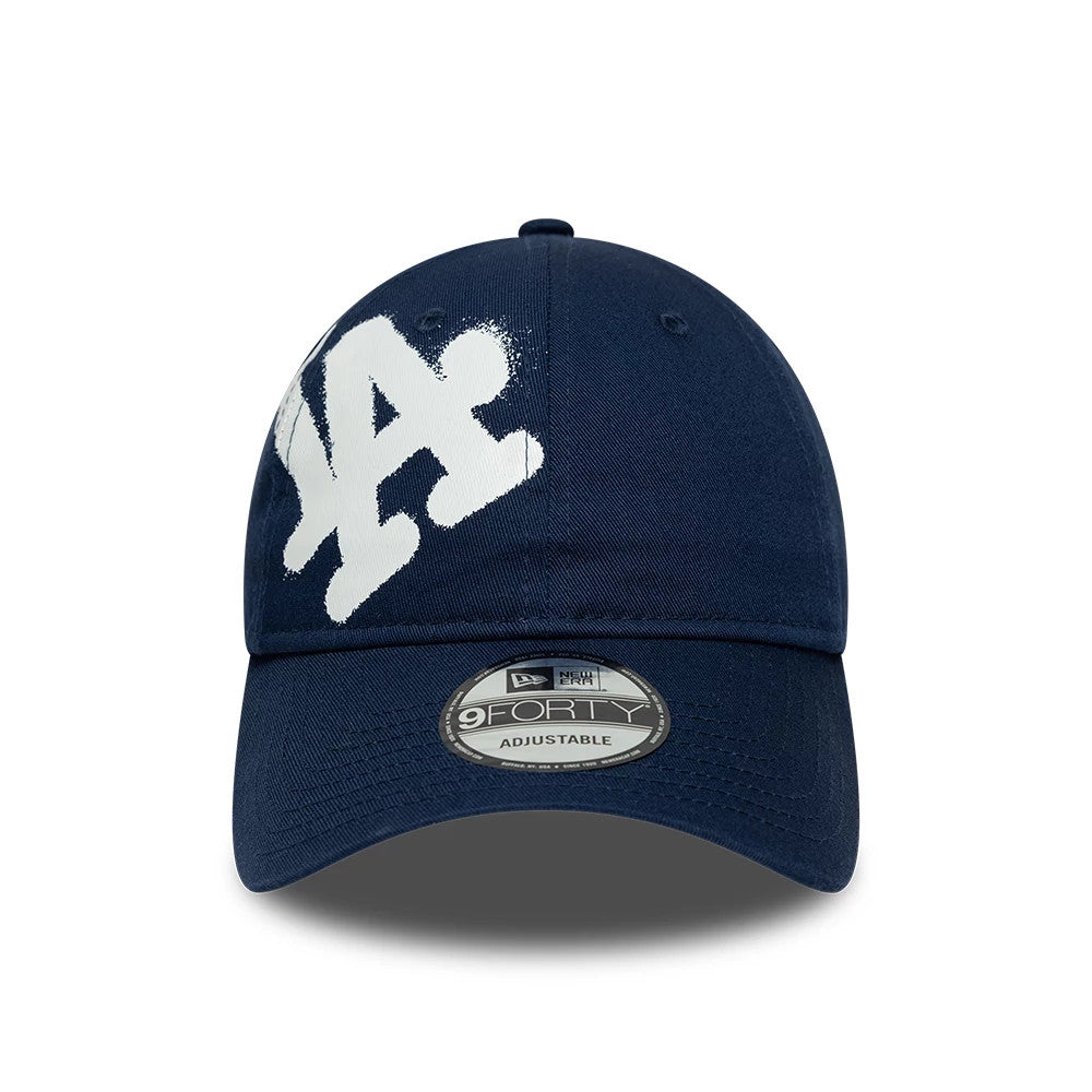 Pictured is this MLB Spray Paint LA Dodgers 9FORTY cap in dark blue. 2