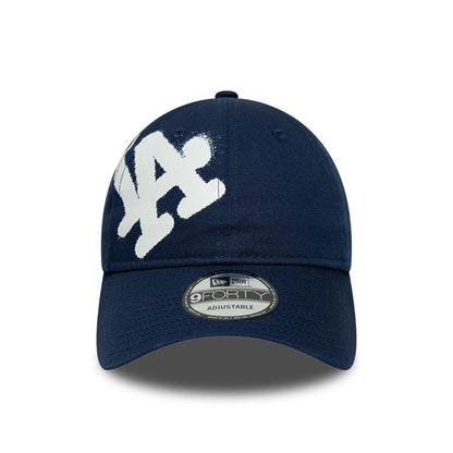 Pictured is this MLB Spray Paint LA Dodgers 9FORTY cap in dark blue. 2
