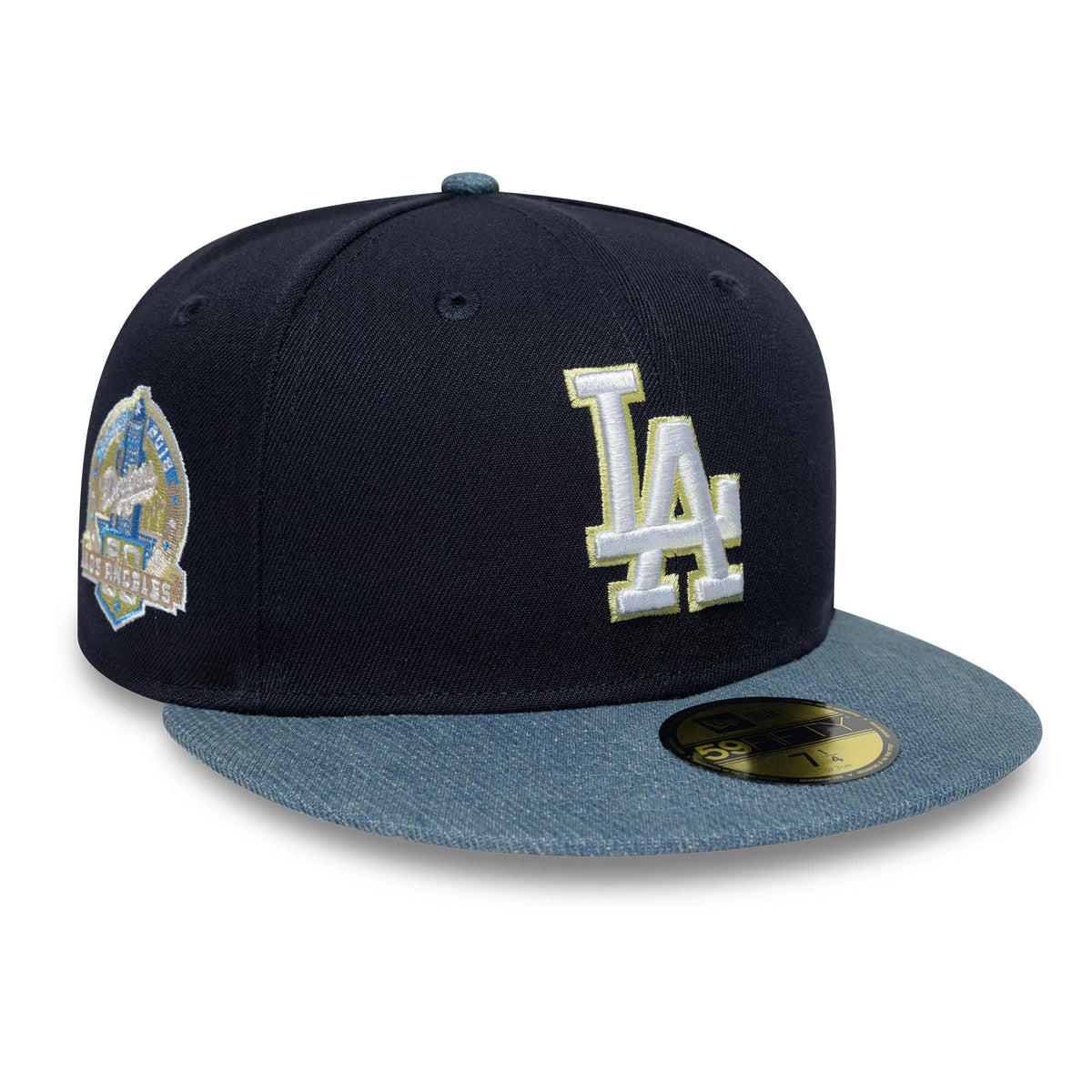 LA Dodgers MLB Denim Mix Navy New Era 59FIFTY Fitted Cap, three-quarter view showing a raised white embroidered LA logo on the front panel, denim blue visor, and a gold 59FIFTY size sticker on the visor.