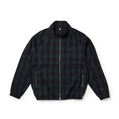 The model is wearing this New Era Blouson Plaid Windbreaker Jacket in Navy. 7
