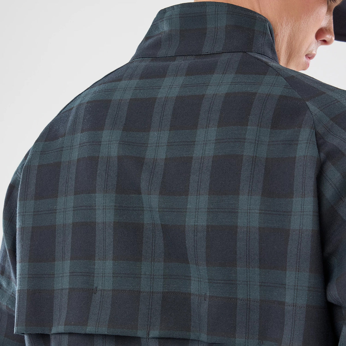 The model is wearing this New Era Blouson Plaid Windbreaker Jacket in Navy. 6