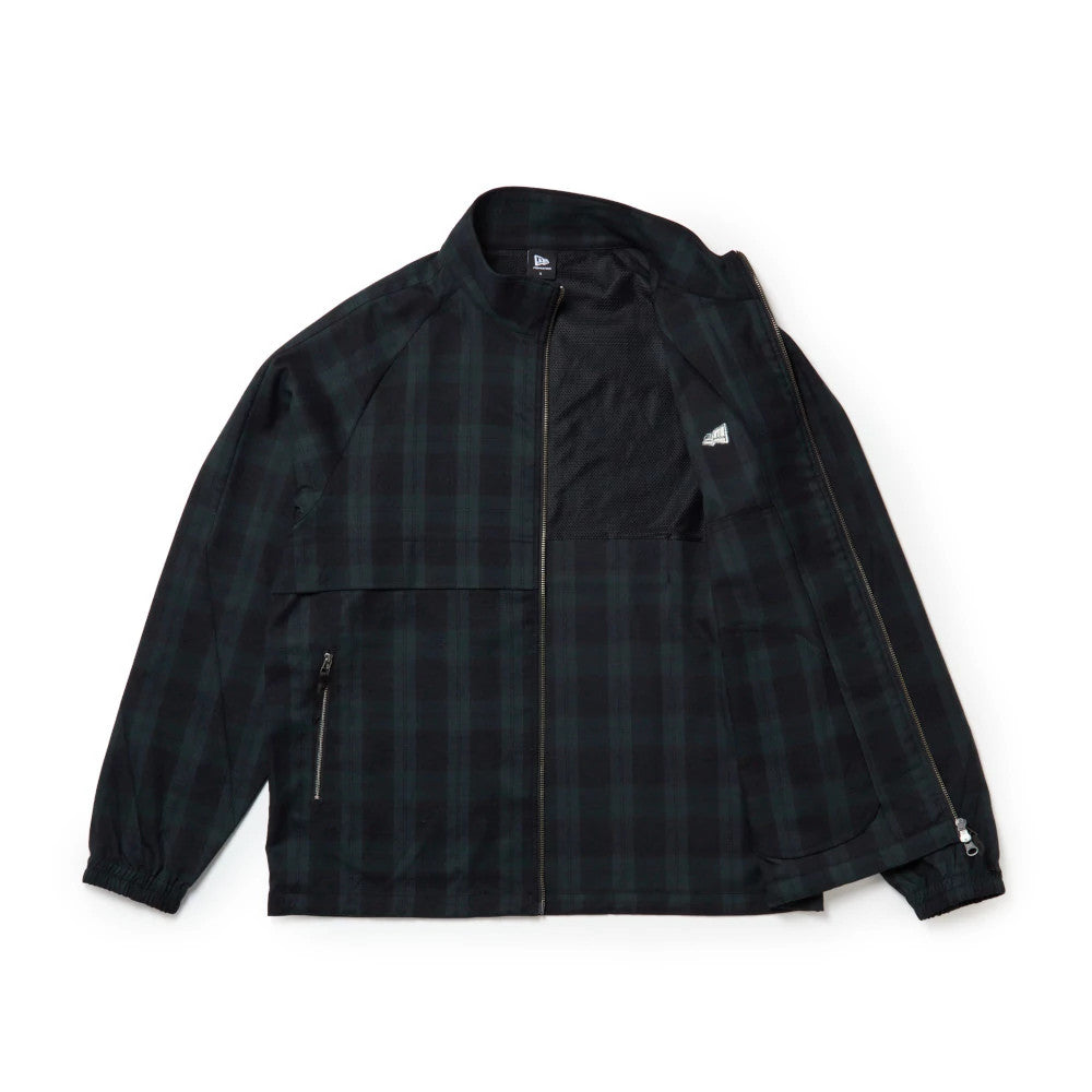 The model is wearing this New Era Blouson Plaid Windbreaker Jacket in Navy. 14