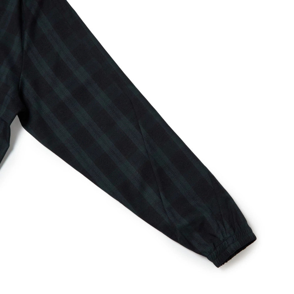 The model is wearing this New Era Blouson Plaid Windbreaker Jacket in Navy. 12