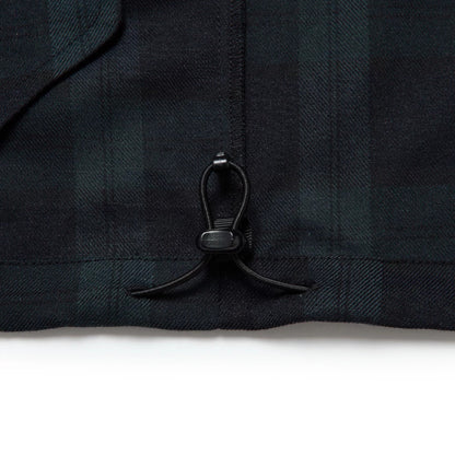 The model is wearing this New Era Blouson Plaid Windbreaker Jacket in Navy. 11