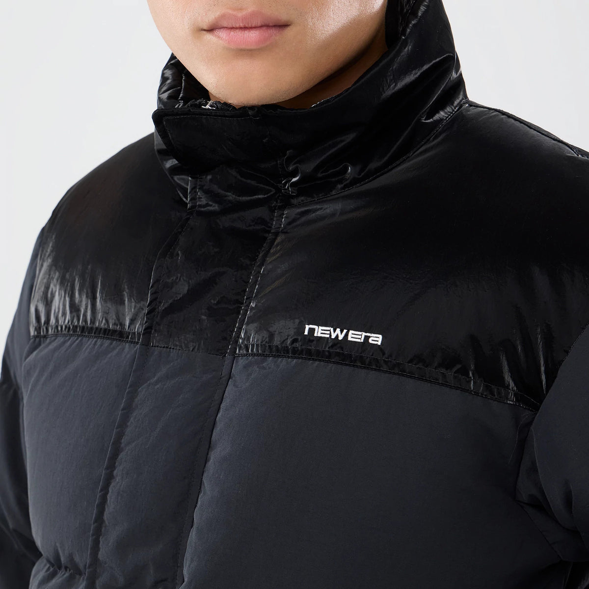The model is wearing this New Era Down Jacket in black. 6