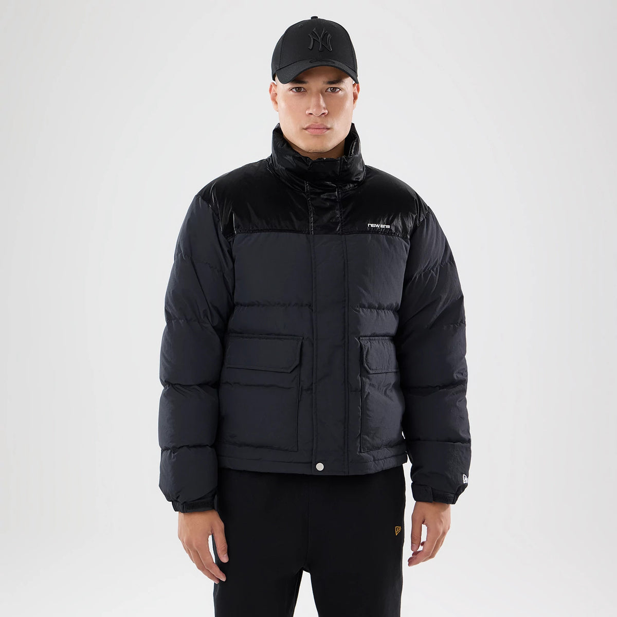 The model is wearing this New Era Down Jacket in black. 1