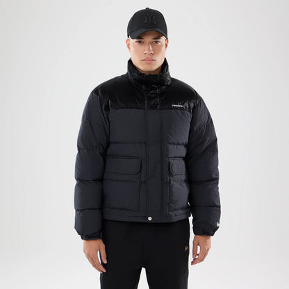 The model is wearing this New Era Down Jacket in black. 1