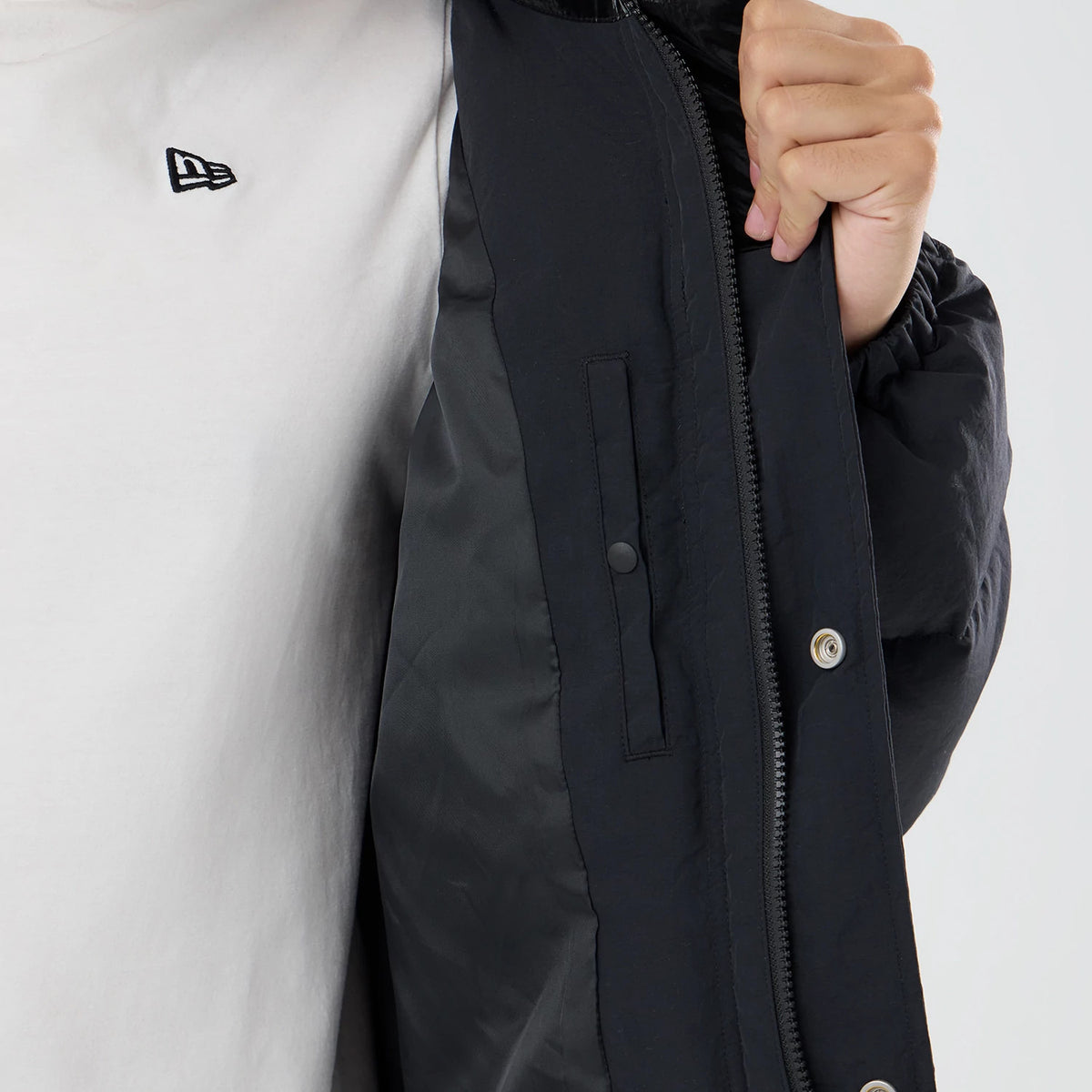 The model is wearing this New Era Down Jacket in black. 7