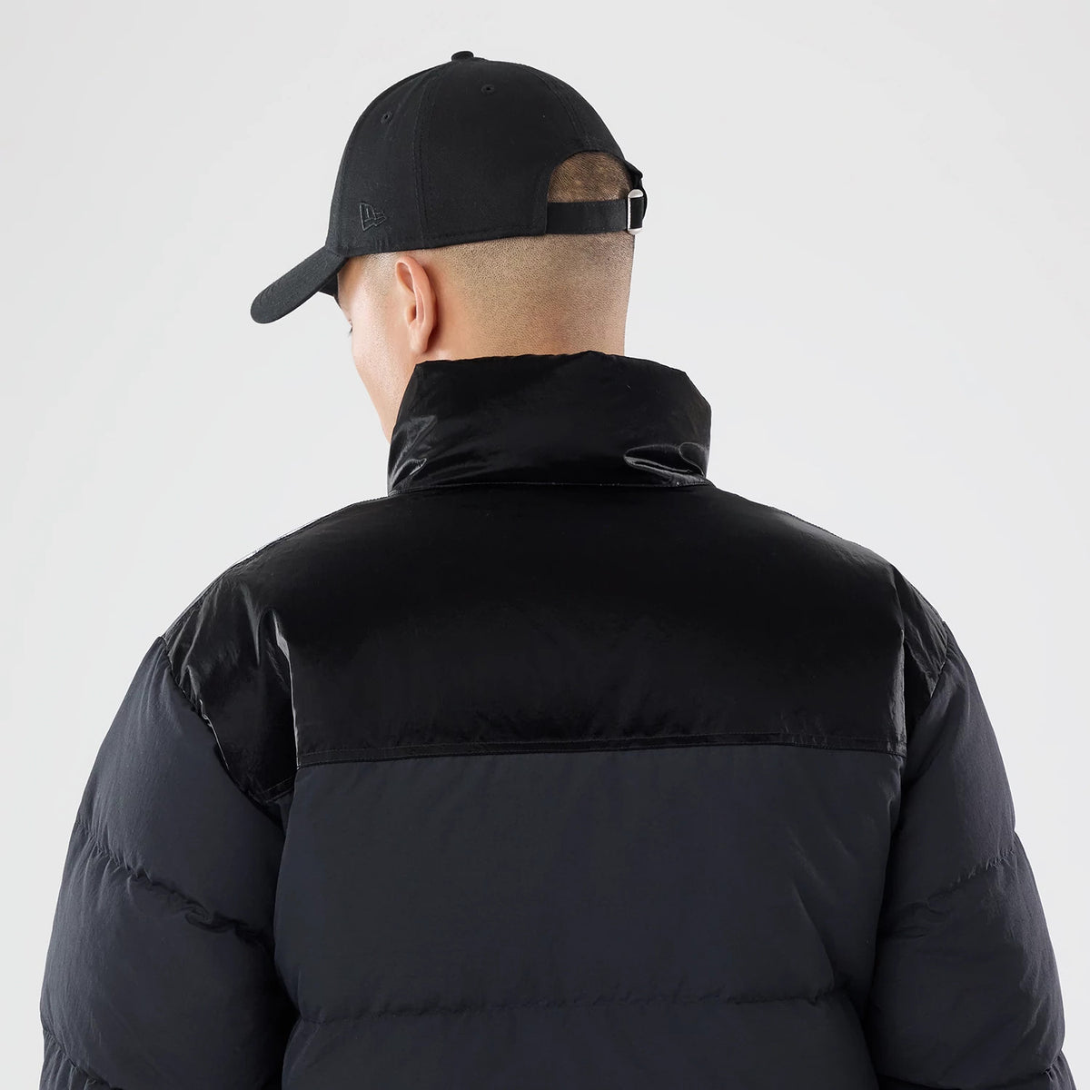 The model is wearing this New Era Down Jacket in black. 5