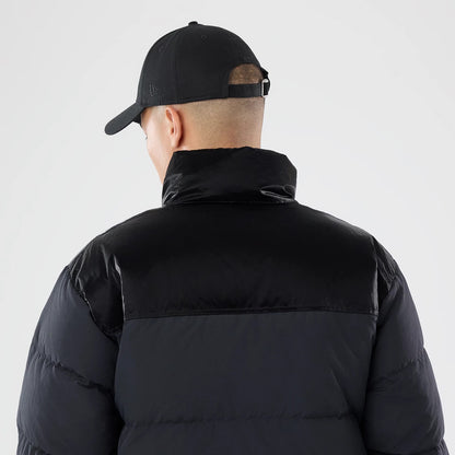 The model is wearing this New Era Down Jacket in black. 5