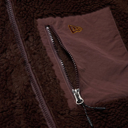 The model is wearing this New Era Blouson Jacket in dark brown. 4