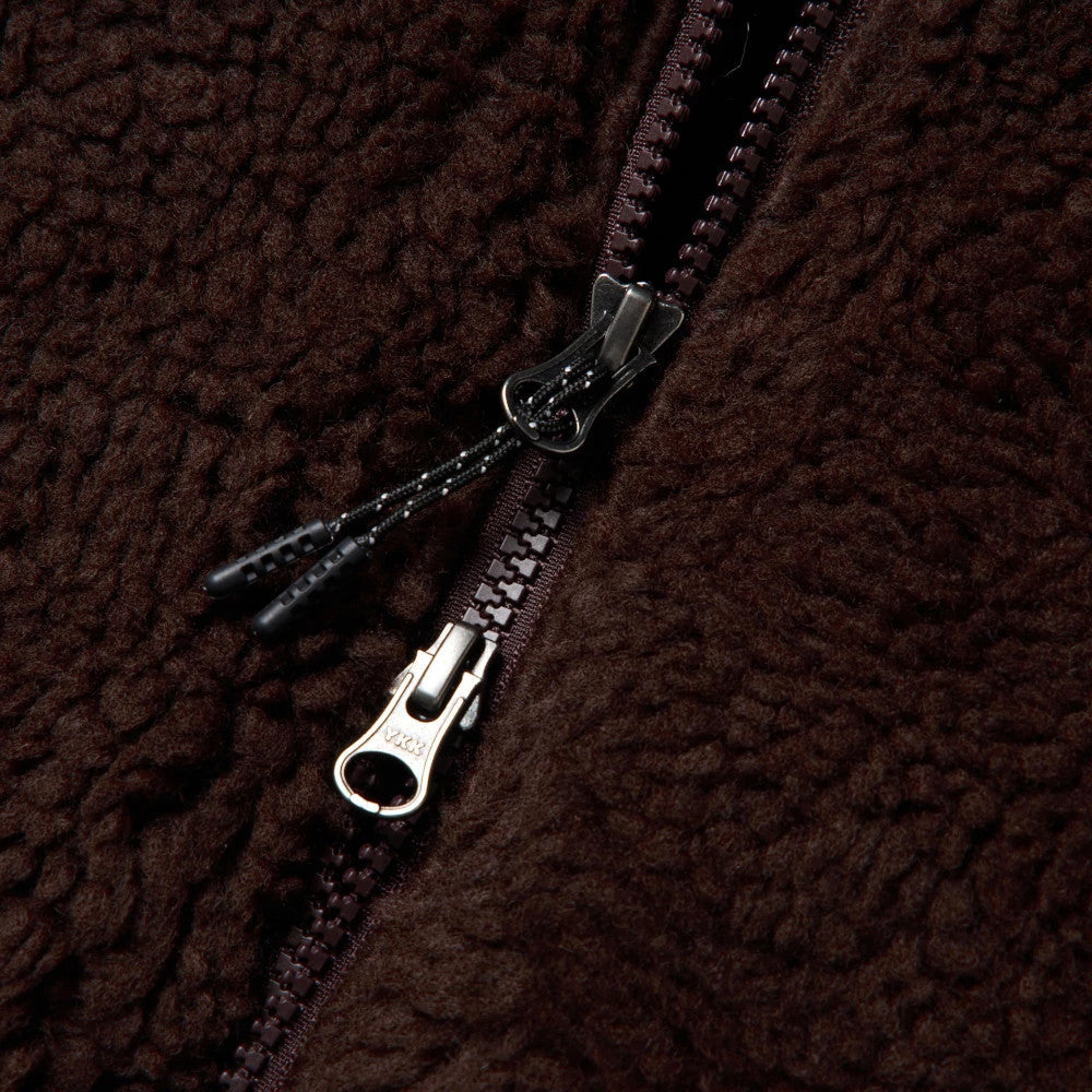 The model is wearing this New Era Blouson Jacket in dark brown. 6