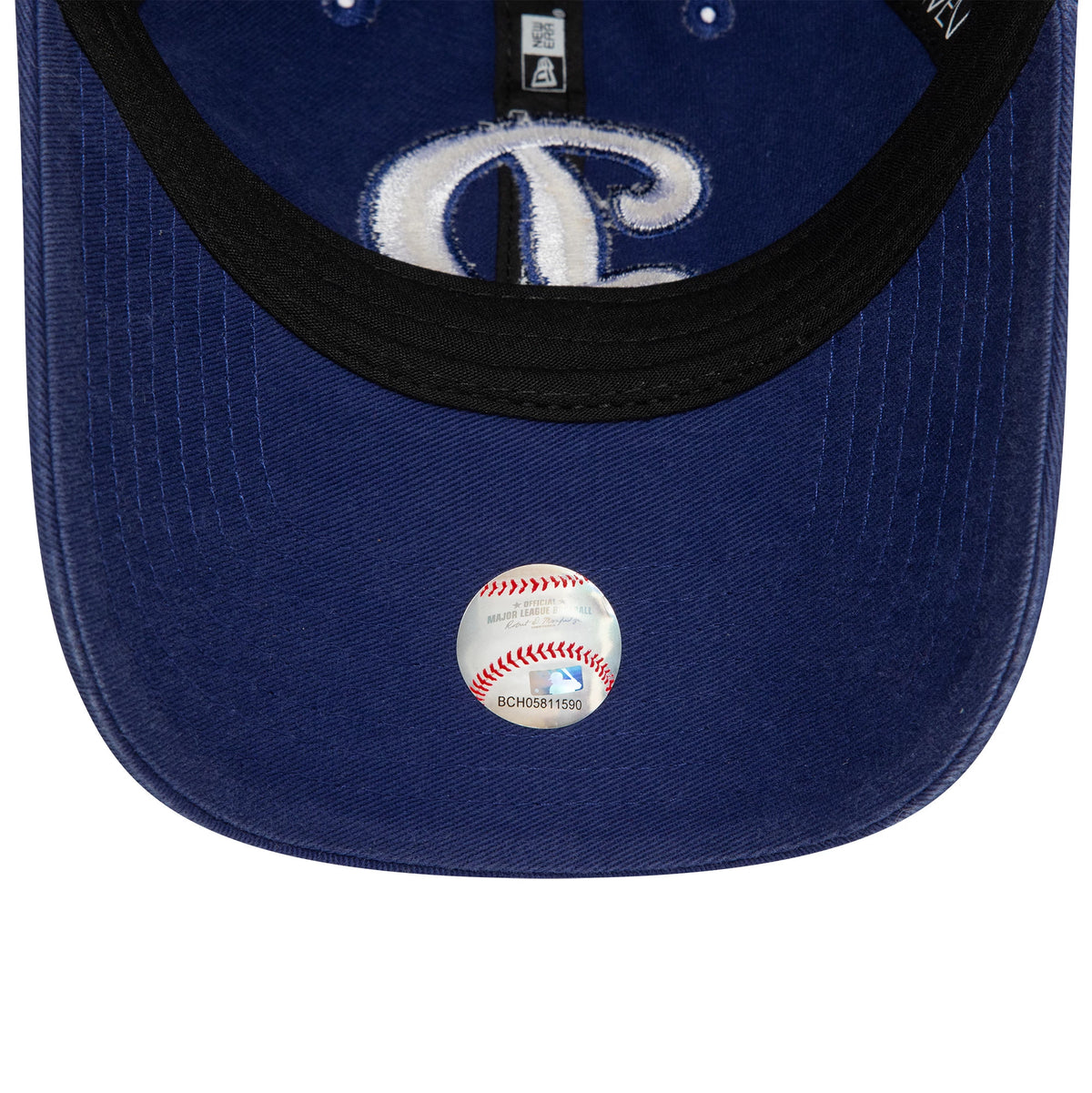 LA Dodgers MLB Core Classic Blue New Era 9TWENTY Adjustable Cap, inside view showing black sweatband and taping with a baseball sticker on the navy undervisor, beneath an embroidered LA logo.