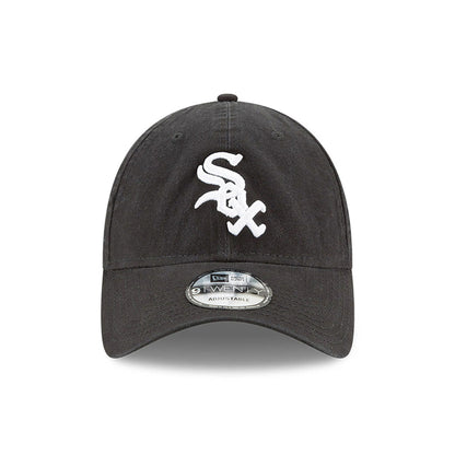 Chicago White Sox MLB Core Classic Black New Era 9TWENTY Adjustable Cap, front view showing the raised white embroidered Sox logo on the unstructured black crown, with a 9TWENTY size sticker on the curved visor.