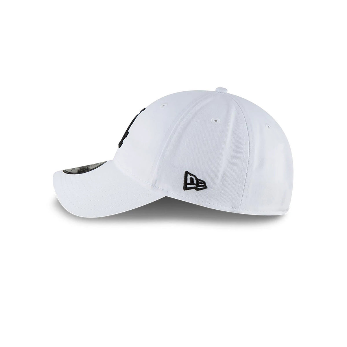 MLB Core Classic Chicago White Sox White New Era 9TWENTY Adjustable Cap, side view with a curved visor, embroidered black New Era flag logo on the left side, and six-panel construction with eyelets and top button.