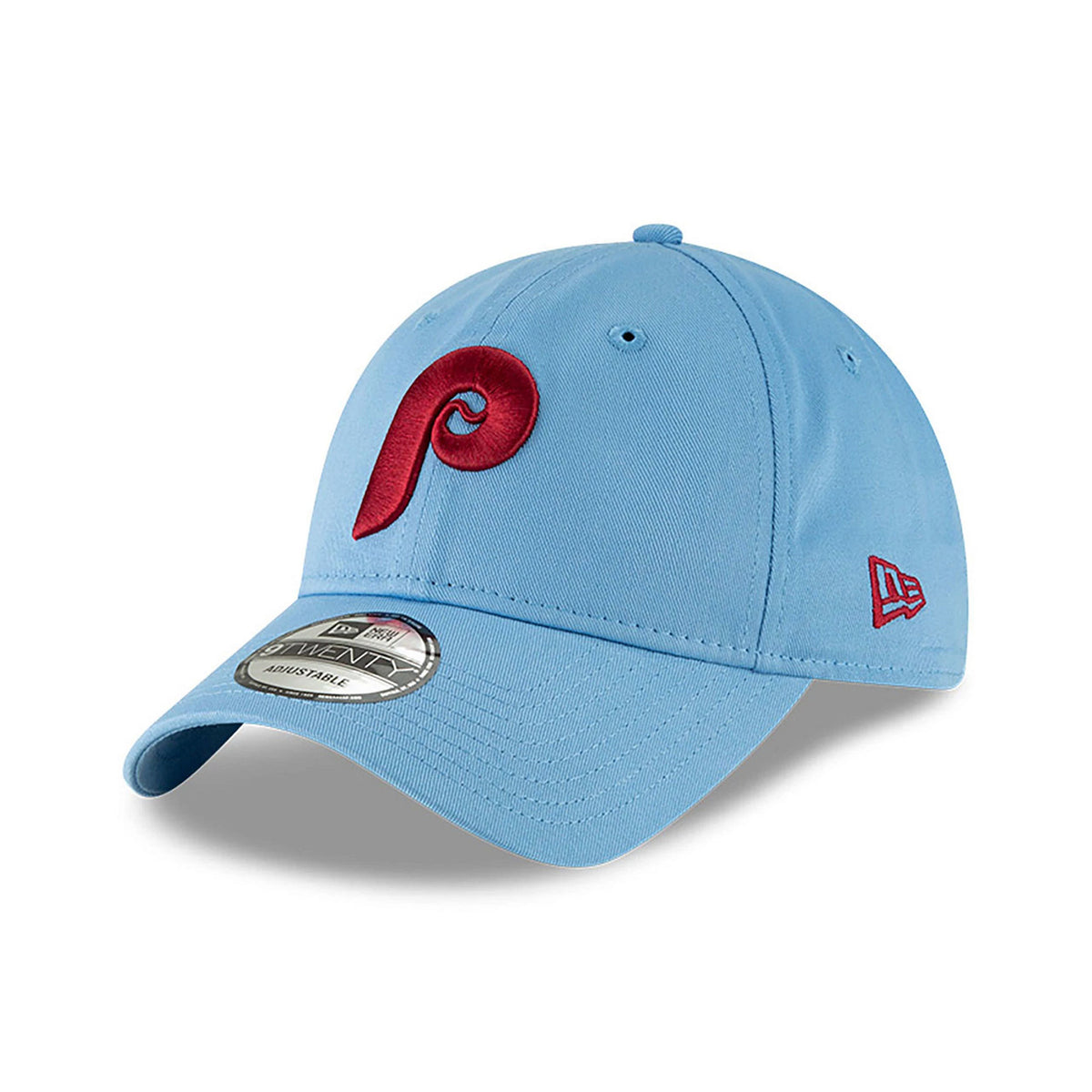 Philadelphia Phillies MLB Core Classic Pastel Blue New Era 9TWENTY Adjustable Cap, three-quarter view showing the raised red front logo, baby blue curved visor with 9TWENTY size sticker, and New Era flag logo on the left side.
