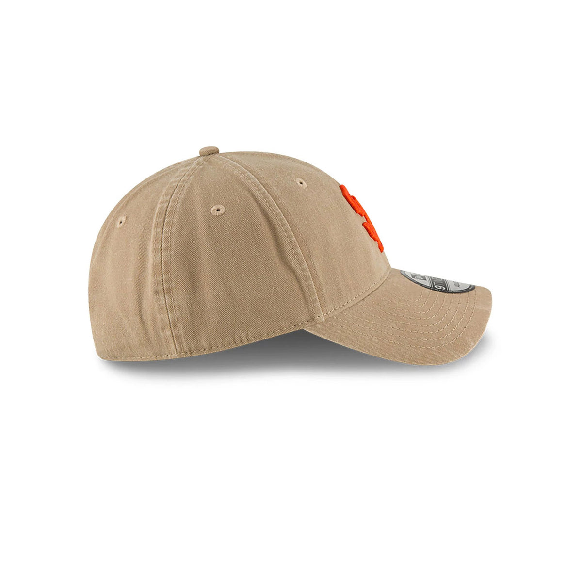 San Francisco Giants MLB Core Classic Beige New Era 9TWENTY Adjustable Cap, side view showing the orange embroidered logo on the front panel, curved visor with 9TWENTY size sticker, and beige top button.