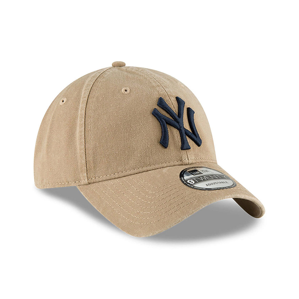 New York Yankees MLB Core Classic Beige New Era 9TWENTY Adjustable Cap, three-quarter view showing the raised navy NY logo embroidered on the front panel, with a curved visor and 9TWENTY size sticker on top.