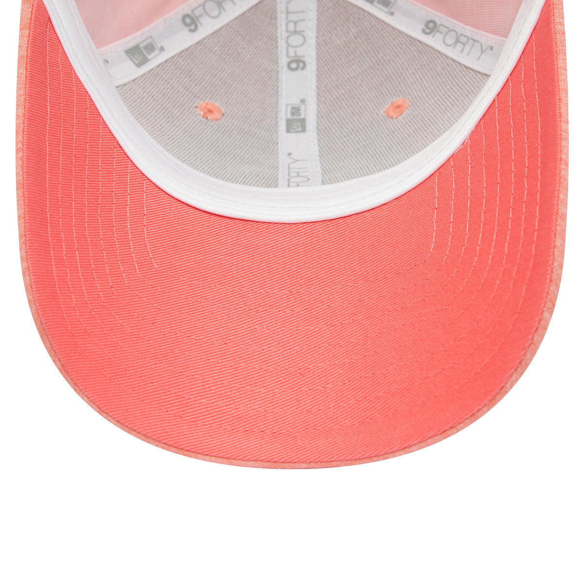 New York Yankees Womens Jersey Pastel Pink New Era 9FORTY Adjustable Cap, inside view showing pastel pink undervisor, white taping with repeated 9FORTY logo, and exposed pink eyelets on the structured crown.