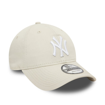 New York Yankees League Essential Stone New Era 9TWENTY Adjustable Cap, three-quarter view showing the white raised embroidered NY logo on the front panel, with a 9TWENTY size sticker on the curved stone visor.