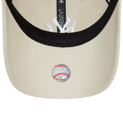 New York Yankees League Essential Stone New Era 9TWENTY Adjustable Cap, inside view showing black taping, a white interior logo, and the underside of the visor with a baseball-themed sticker.