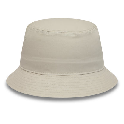 New Era Essential Tapered Stone Bucket Hat, front view showing the seamless design with a gently sloping brim and subtle stitching on the crown and brim, creating a clean and modern look.