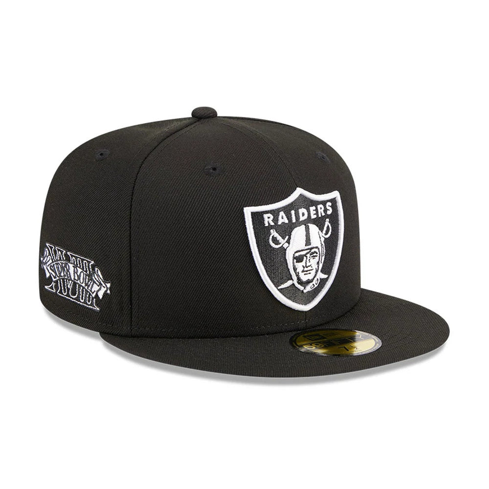 Las Vegas Raiders NFL Evergreen Black New Era 59FIFTY Fitted Cap, three-quarter view showing the white embroidered Raiders logo on the front panel, with a fan favourite graphic on the right side and a gold 59FIFTY size sticker on the visor.