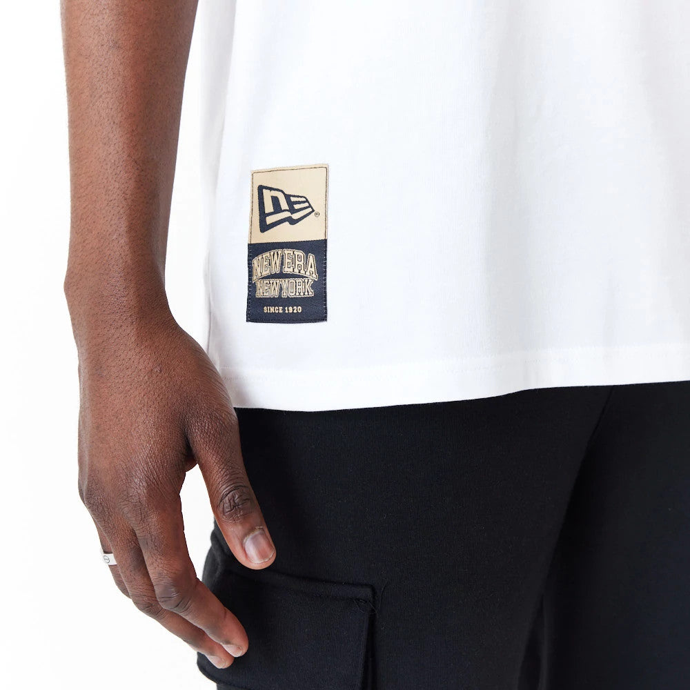 The Male model is wearing New Era Sticker White Oversized T-Shirt 4
