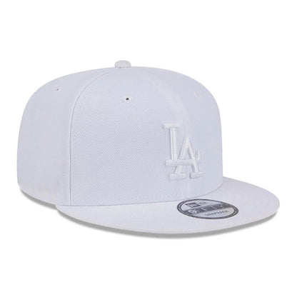 LA Dodgers MLB Evergreen White New Era 9FIFTY Snapback Adjustable Cap, front view showing the raised white LA logo embroidered on the front panel, with a flat visor and 9FIFTY size sticker on the top.