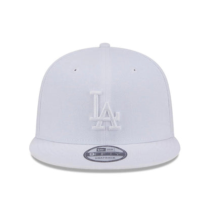 LA Dodgers MLB Evergreen White New Era 9FIFTY Snapback Adjustable Cap, front view showing raised white LA logo embroidered on the front panel above the flat visor, with a 9FIFTY size sticker centred on the visor.