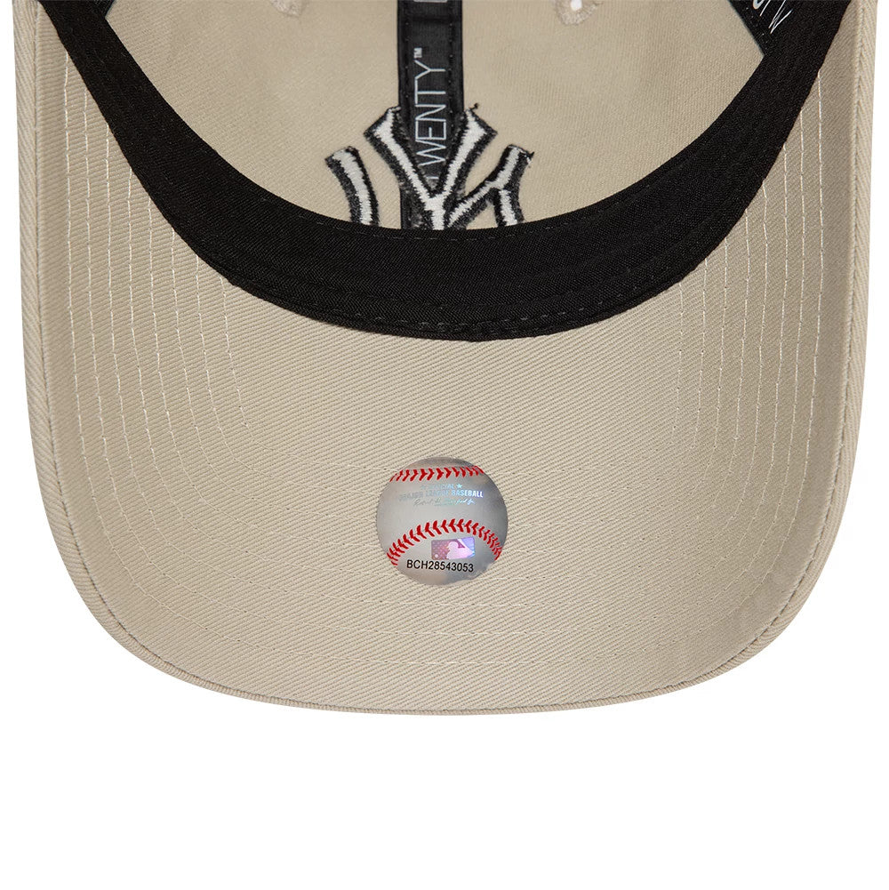 New York Yankees League Essential Core Stone New Era 9TWENTY Adjustable Cap, inside view showing a black sweatband, New Era taping, embroidered NY logo, and round MLB sticker on a beige undervisor.